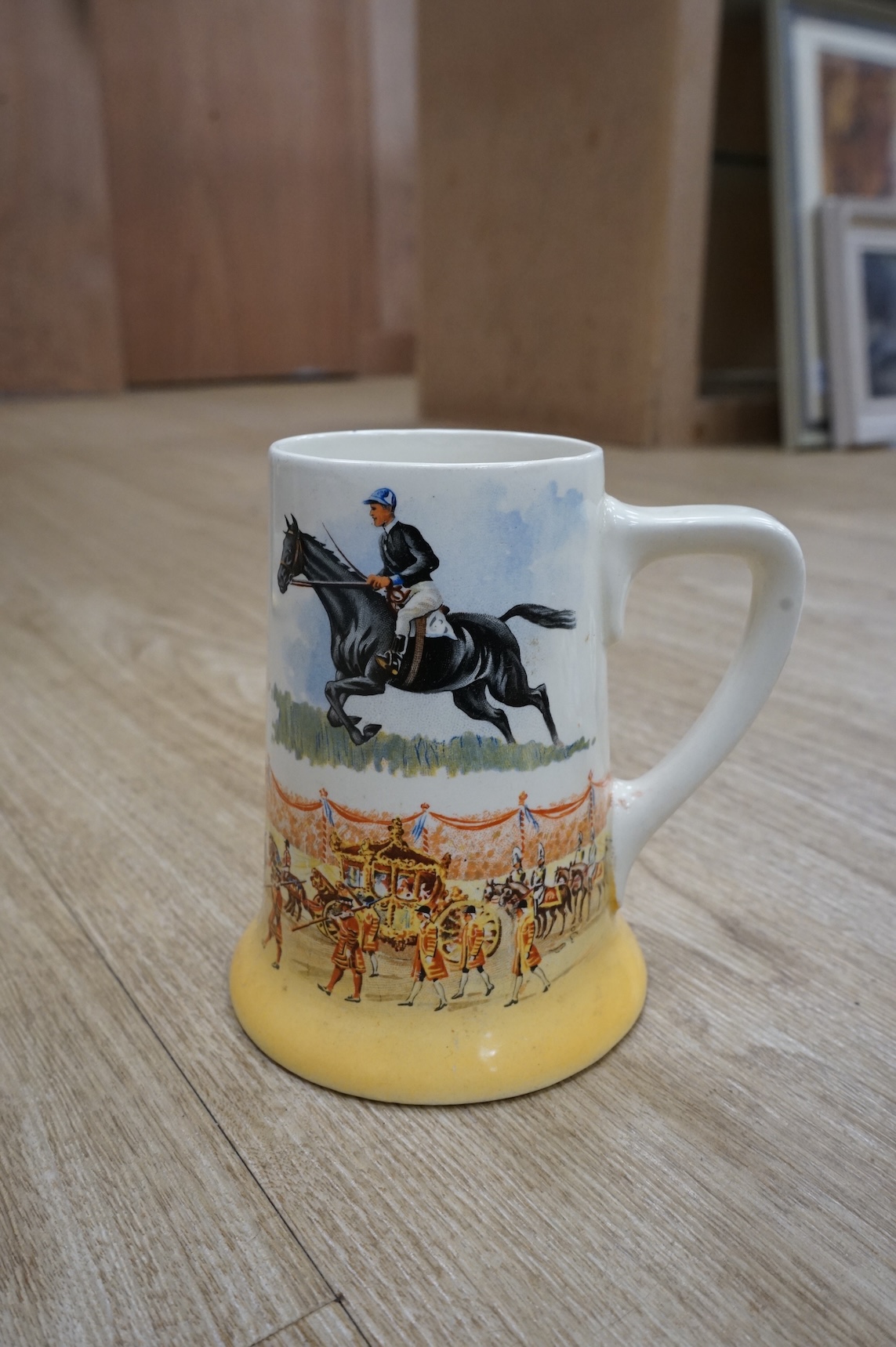 A quantity of plated cutlery, a Royal Doulton limited series sporting mug by Teofani and an Aynsley plate, 27.5cm diameter.